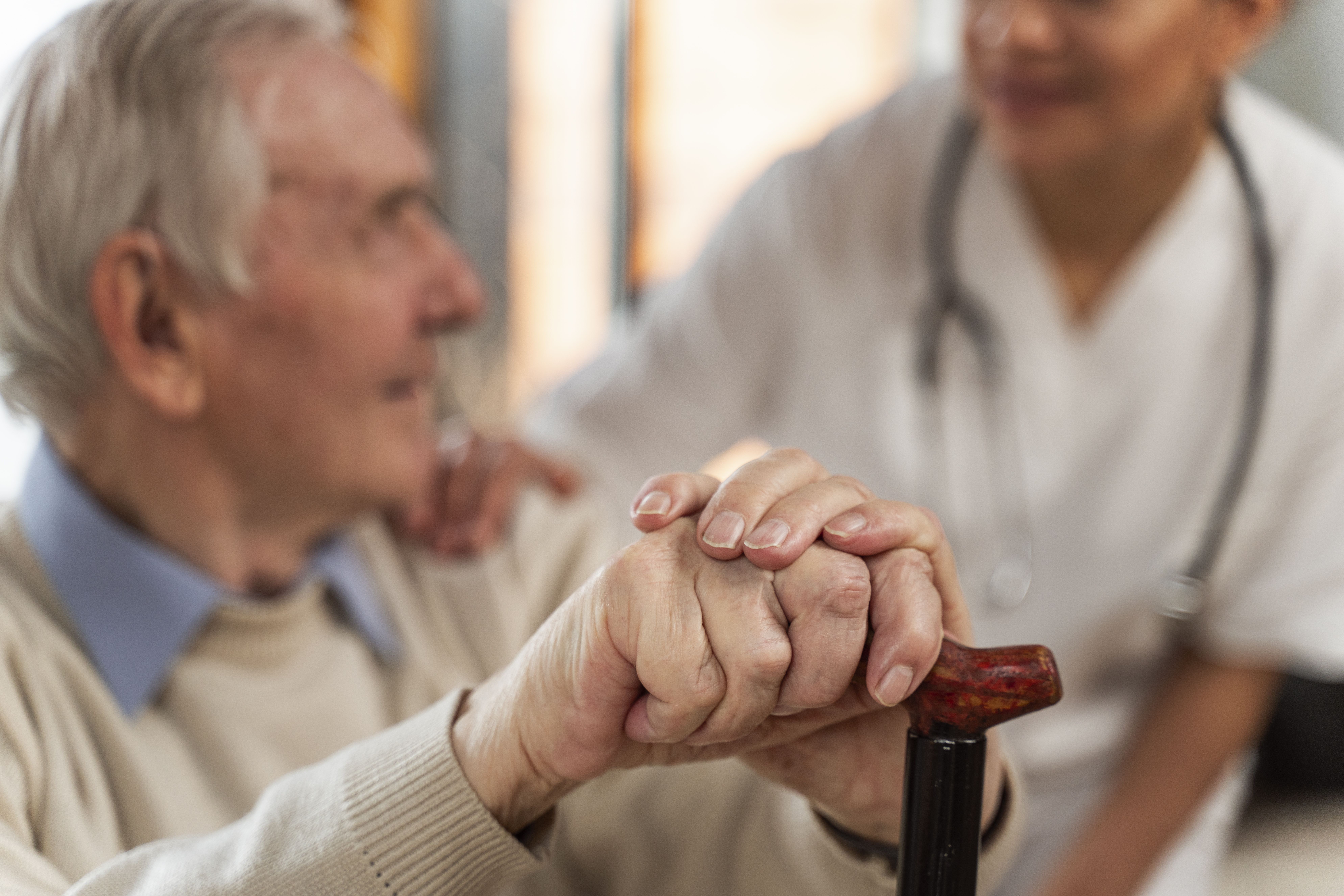 Casual Senior Man Home With Doctor